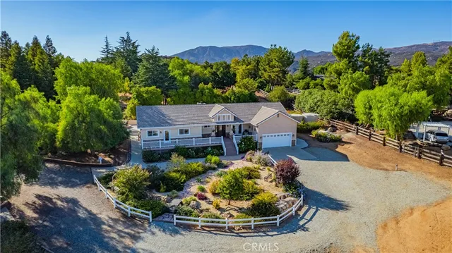 a bedroom with a bed mirror and a window