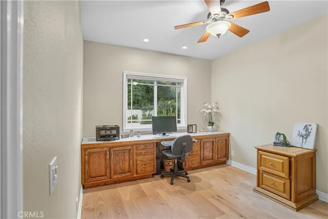 a view of a house with swimming pool and furniture