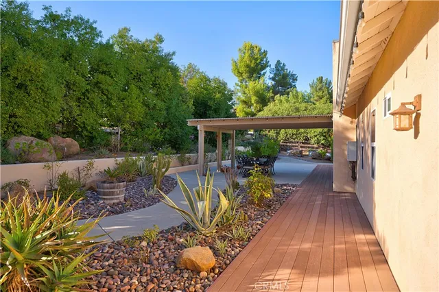 a view of chairs and table in patio