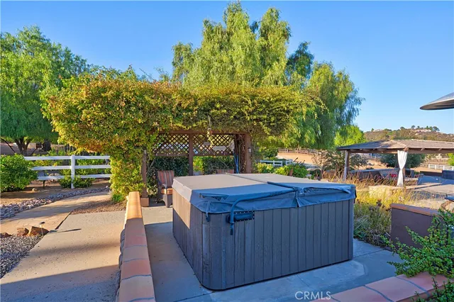 a front view of a house with a yard table and chairs