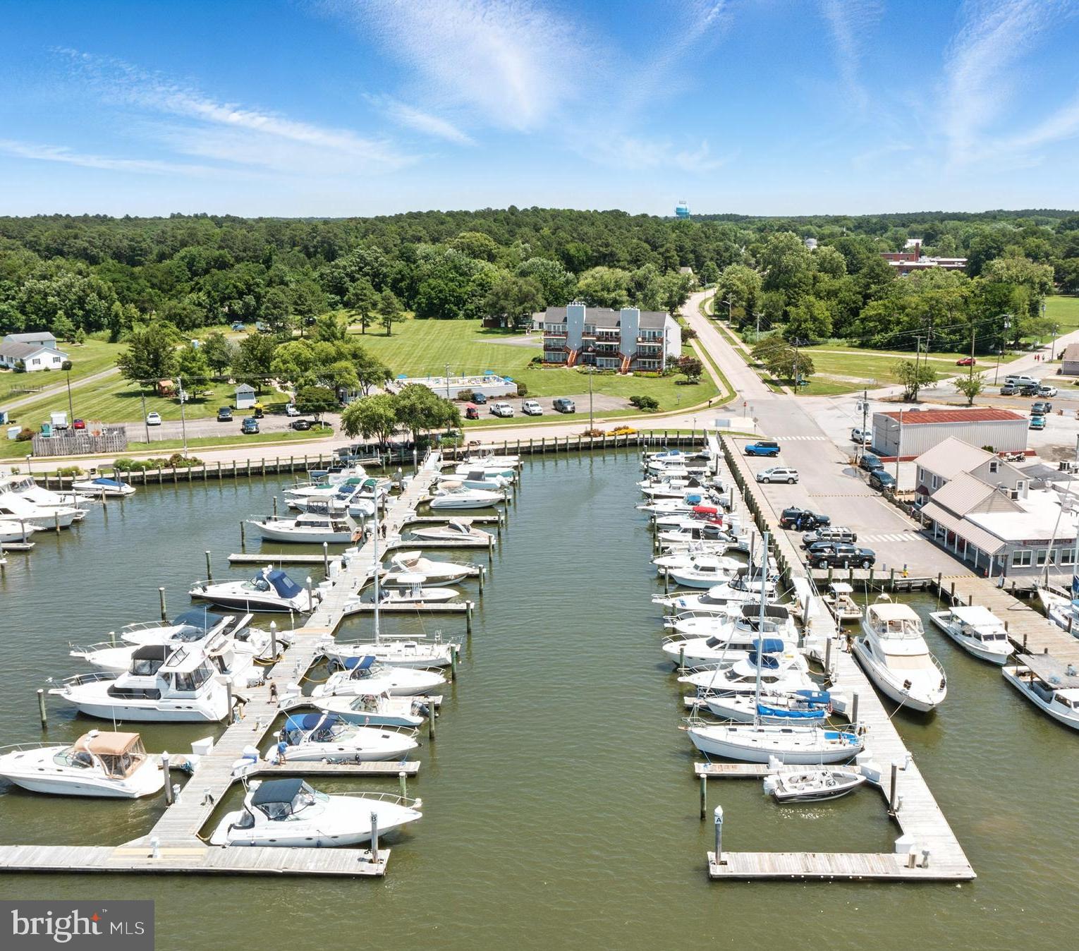 21090 West Sharp Street, Unit 133 Rock Hall, MD 21661 - Photo 2 of 40 a view of a lake with a yard
