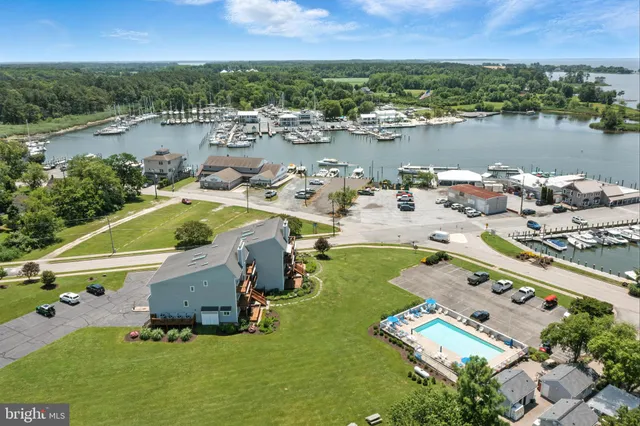 a picture of houses with outdoor space and lake view