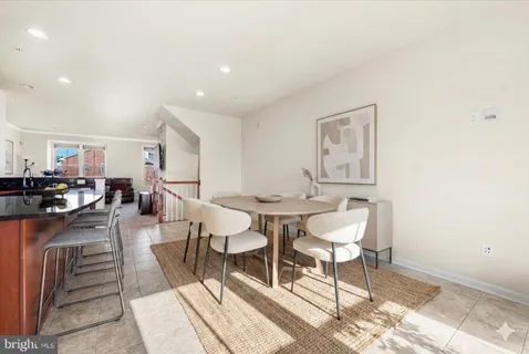 a view of a dinning tables and chairs in the patio