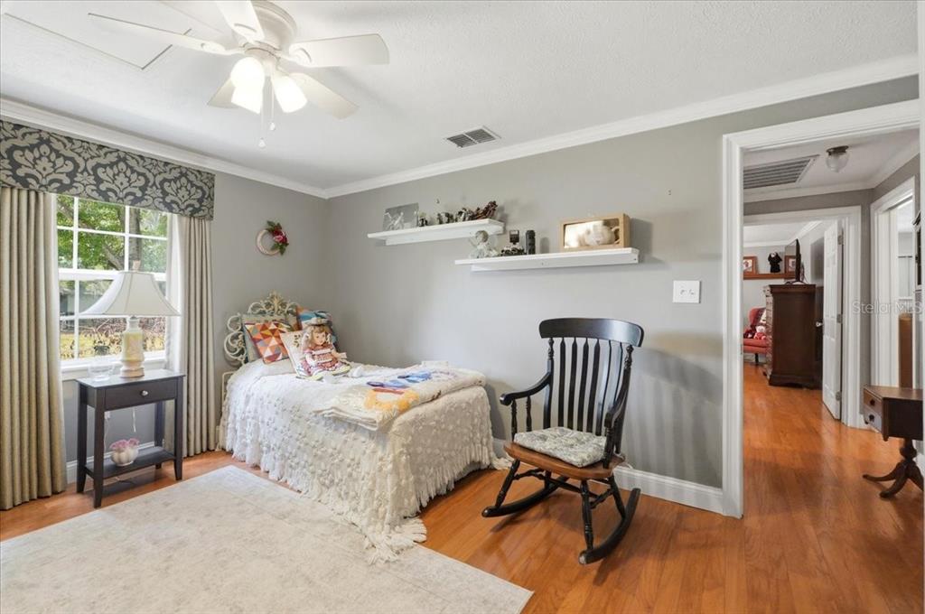 2910 Fritzke Road Dover, FL 33527 - Photo 13 of 100 a bedroom with furniture wooden floor and a window