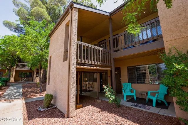 a view of an house with backyard porch and sitting area