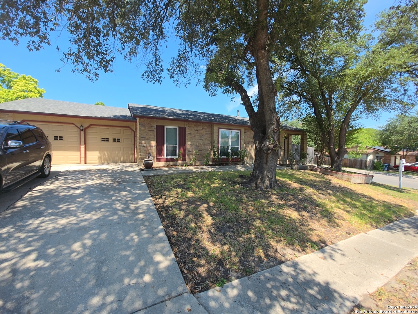 13339 Los Indios San Antonio, TX 78233 - Photo 2 of 17 a front view of a house with a yard