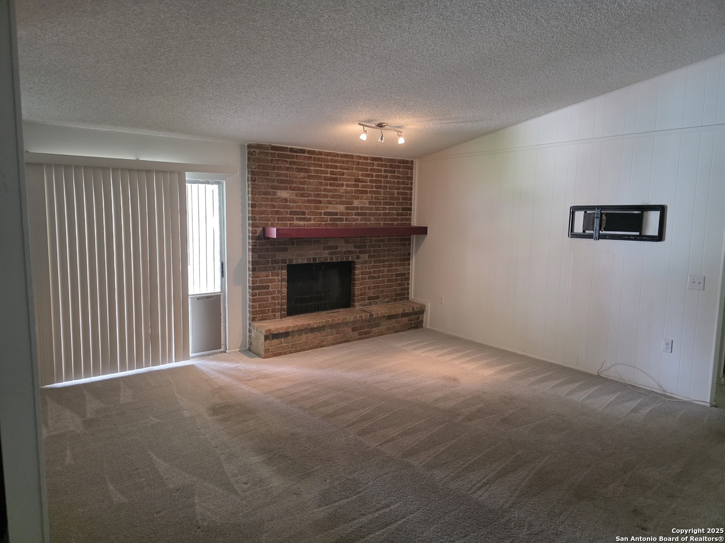 13339 Los Indios San Antonio, TX 78233 - Photo 5 of 17 a view of empty room with a fireplace