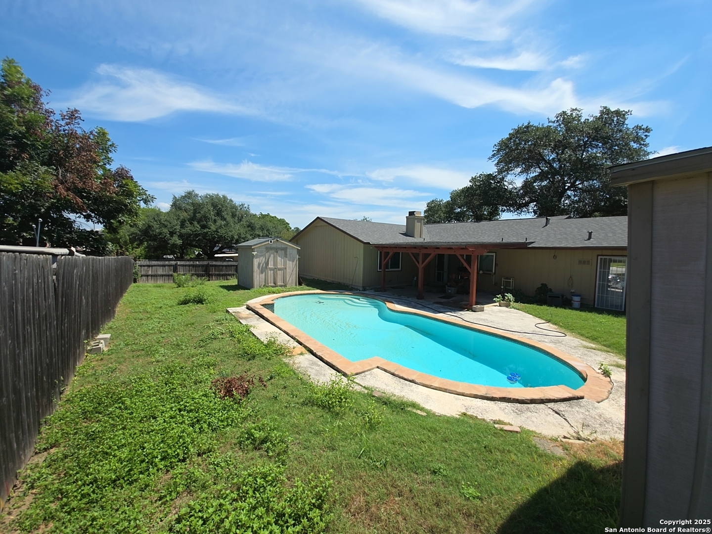 13339 Los Indios San Antonio, TX 78233 - Photo 6 of 17 a view of a swimming pool with a yard