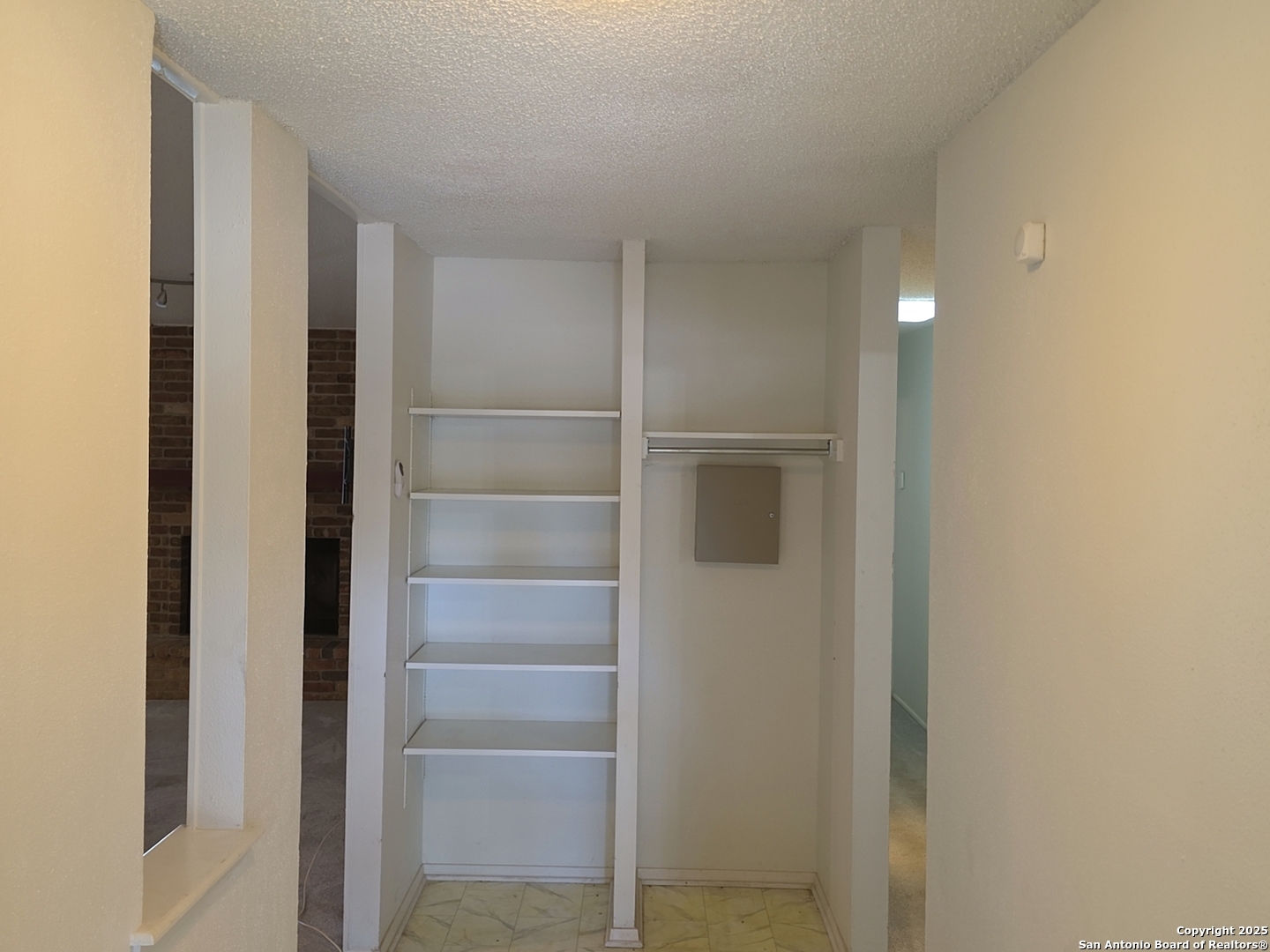 13339 Los Indios San Antonio, TX 78233 - Photo 8 of 17 a view of walk in closet with empty racks