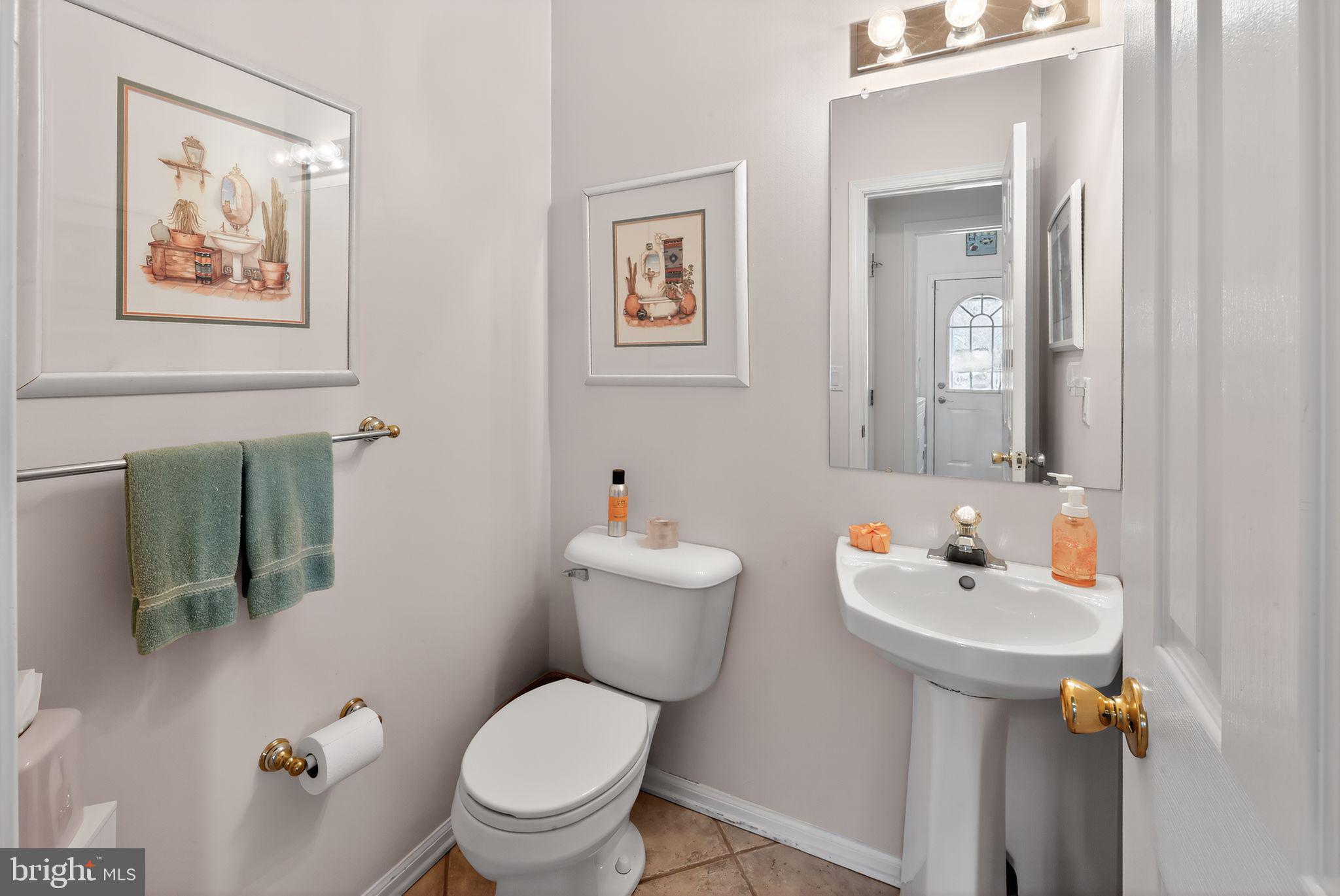 78 Emerald Ridge Drive Bear, DE 19701 - Photo 15 of 30 a bathroom with a toilet sink and mirror