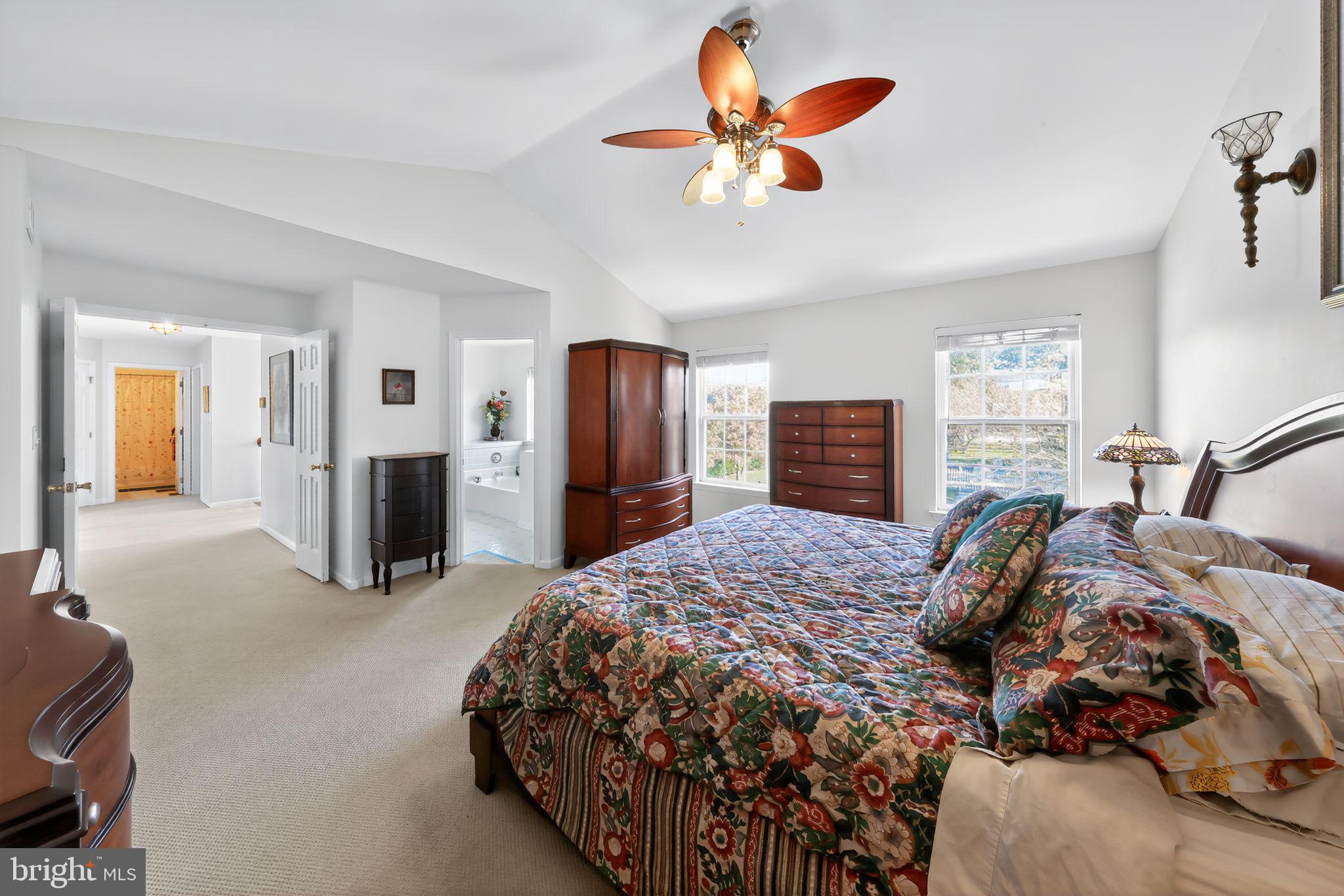 78 Emerald Ridge Drive Bear, DE 19701 - Photo 18 of 30 a bedroom with a bed and a chandelier