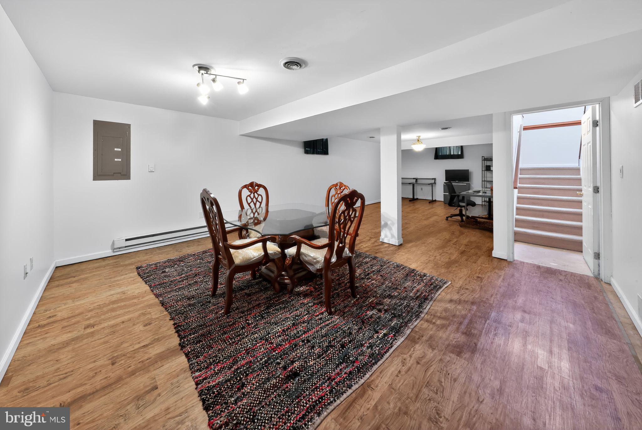 78 Emerald Ridge Drive Bear, DE 19701 - Photo 26 of 30 a dining room with furniture wooden floor and a rug