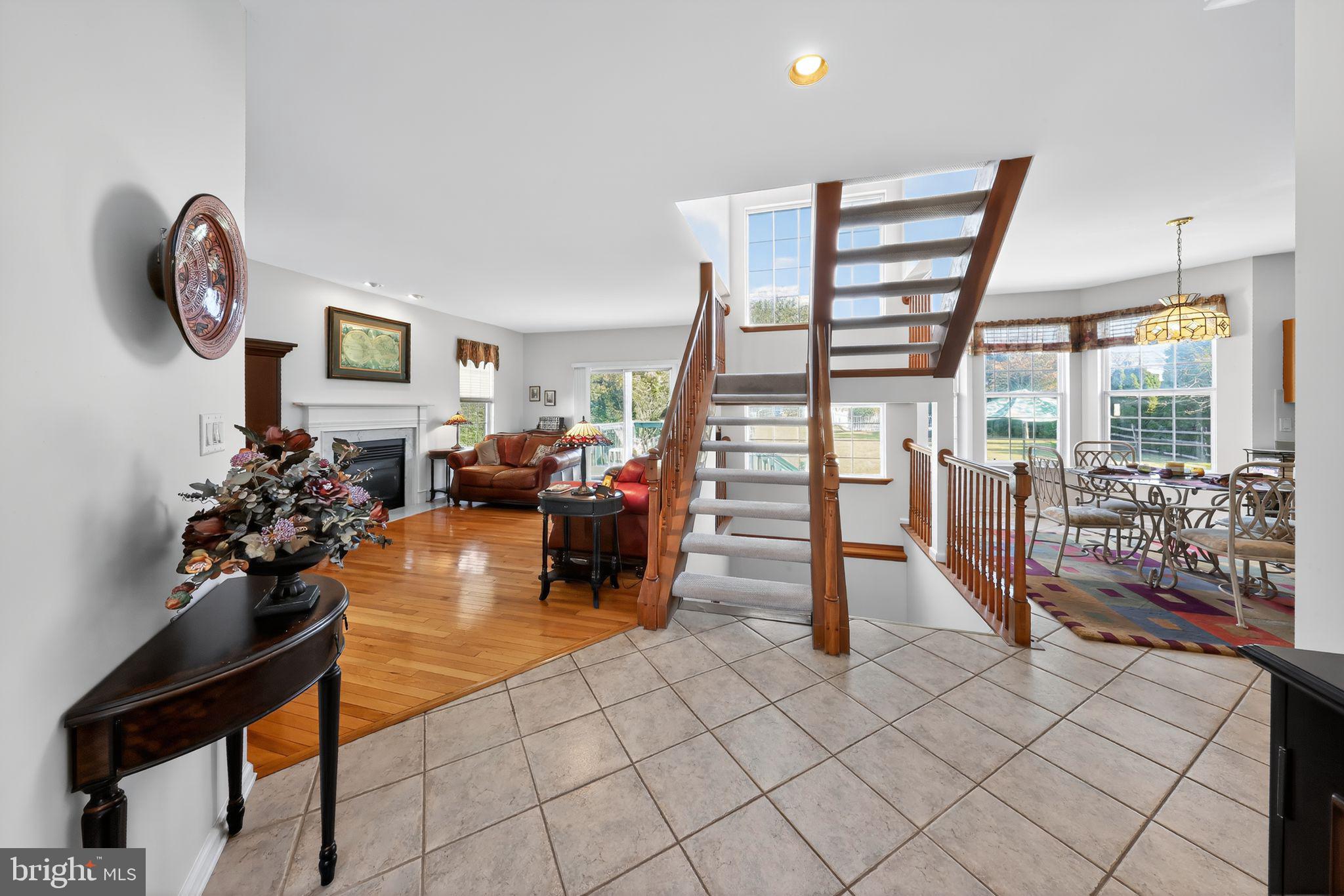 78 Emerald Ridge Drive Bear, DE 19701 - Photo 3 of 30 a living room with furniture a piano and a potted plant