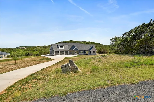 a view of a lake with a house in the background