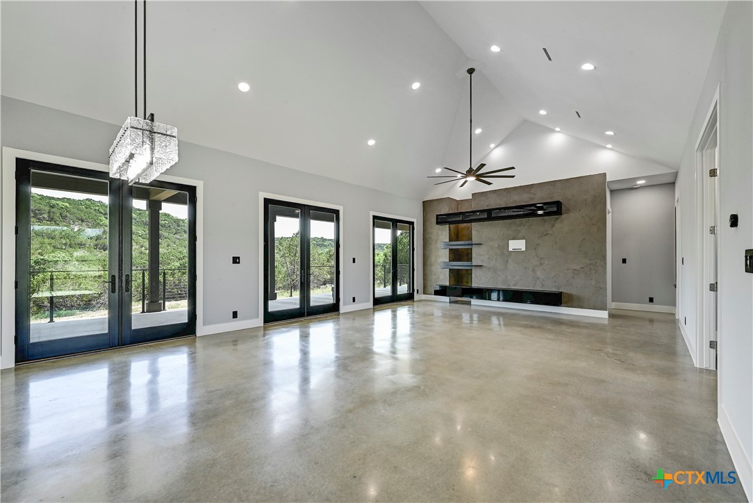 304 Spring Hollow Drive Bertram, TX 78605 - Photo 15 of 45 a view of an empty room with window and chandelier