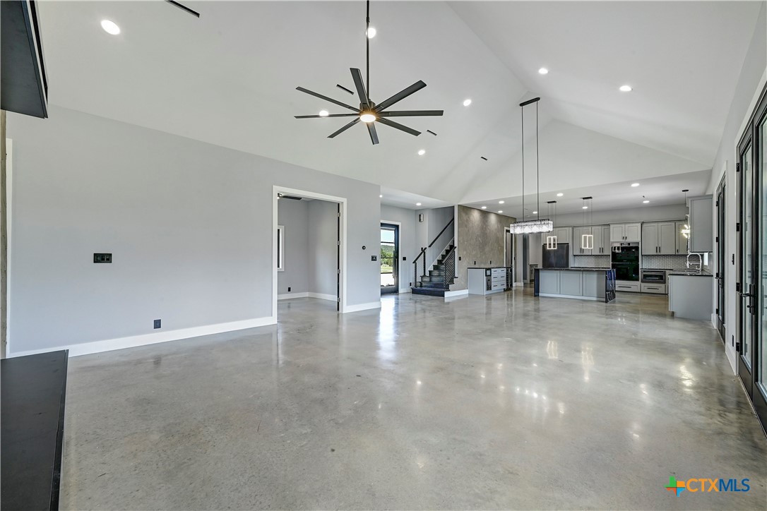 304 Spring Hollow Drive Bertram, TX 78605 - Photo 16 of 45 a view of a livingroom with furniture and a ceiling fan