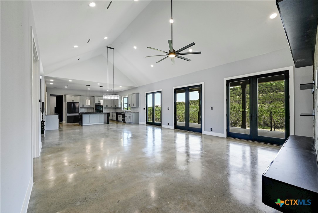304 Spring Hollow Drive Bertram, TX 78605 - Photo 20 of 45 a view of a livingroom with furniture a ceiling fan and window