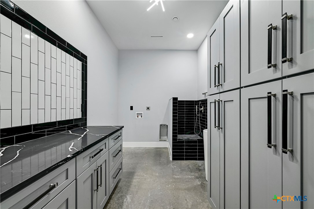 304 Spring Hollow Drive Bertram, TX 78605 - Photo 26 of 45 a view of a kitchen with utility area