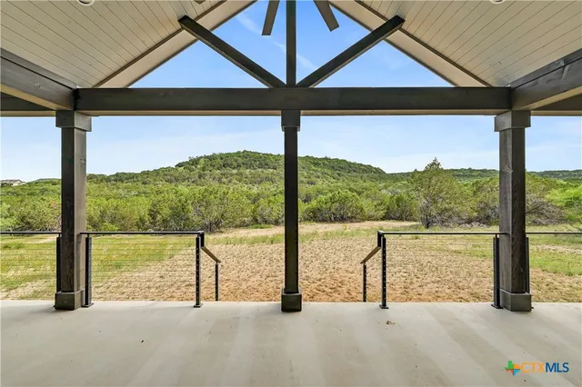 a front view of a house with a floor to ceiling window