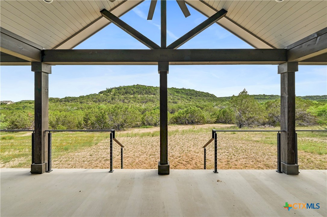 304 Spring Hollow Drive Bertram, TX 78605 - Photo 6 of 45 a view of a street with an outdoor seating
