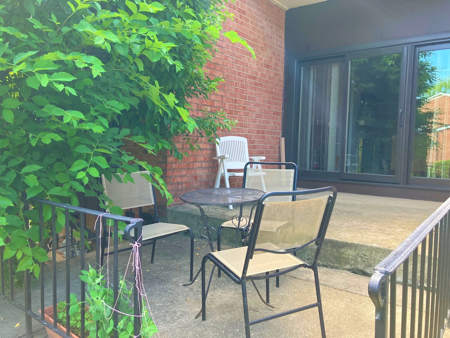 19-w286 Governors Trail Oak Brook, IL 60523 - Photo 14 of 17 a view of a chairs and table in the balcony