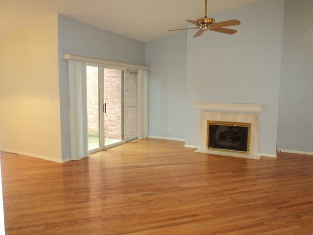 19-w286 Governors Trail Oak Brook, IL 60523 - Photo 2 of 17 a view of an empty room with a fireplace and a window