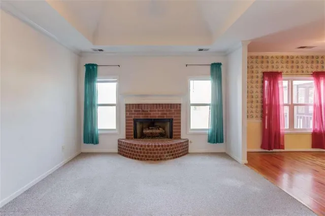a view of a kitchen with a sink and a refrigerator