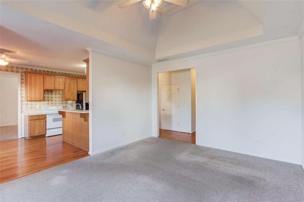3322 Henderson View Court Southwest Loganville, GA 30052 - Photo 12 of 47 a view of a kitchen with a sink and a refrigerator