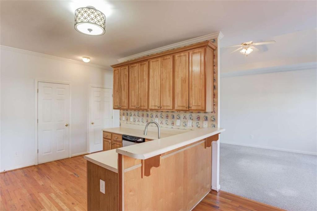 3322 Henderson View Court Southwest Loganville, GA 30052 - Photo 15 of 47 a kitchen with a sink and a refrigerator