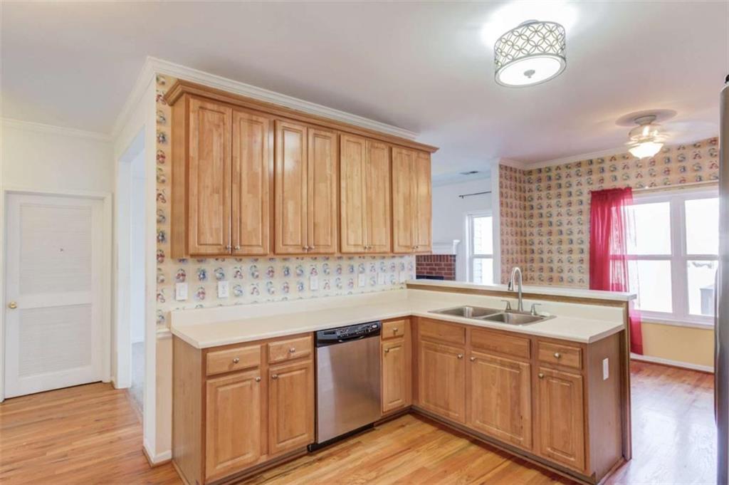 3322 Henderson View Court Southwest Loganville, GA 30052 - Photo 16 of 47 a kitchen with a sink window and cabinets