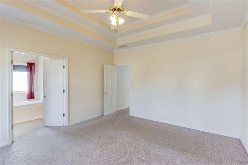 3322 Henderson View Court Southwest Loganville, GA 30052 - Photo 19 of 47 a view of an empty room with a ceiling fan