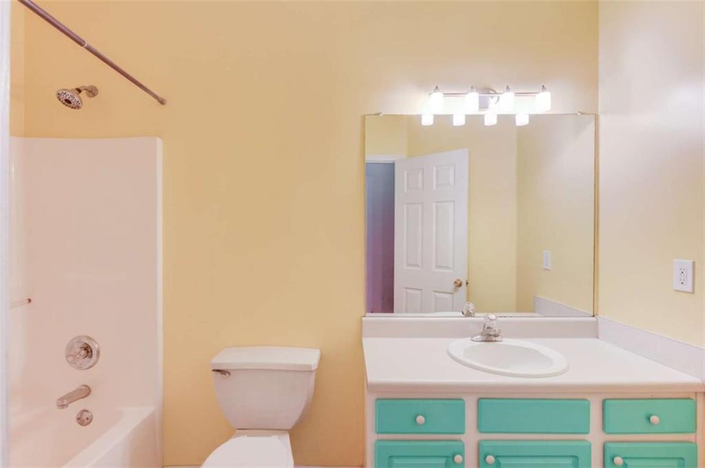 3322 Henderson View Court Southwest Loganville, GA 30052 - Photo 25 of 47 a bathroom with a sink a toilet and a mirror