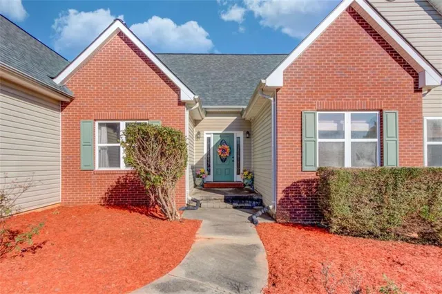 a front view of a house with a yard