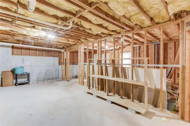a view of a room with wooden walls