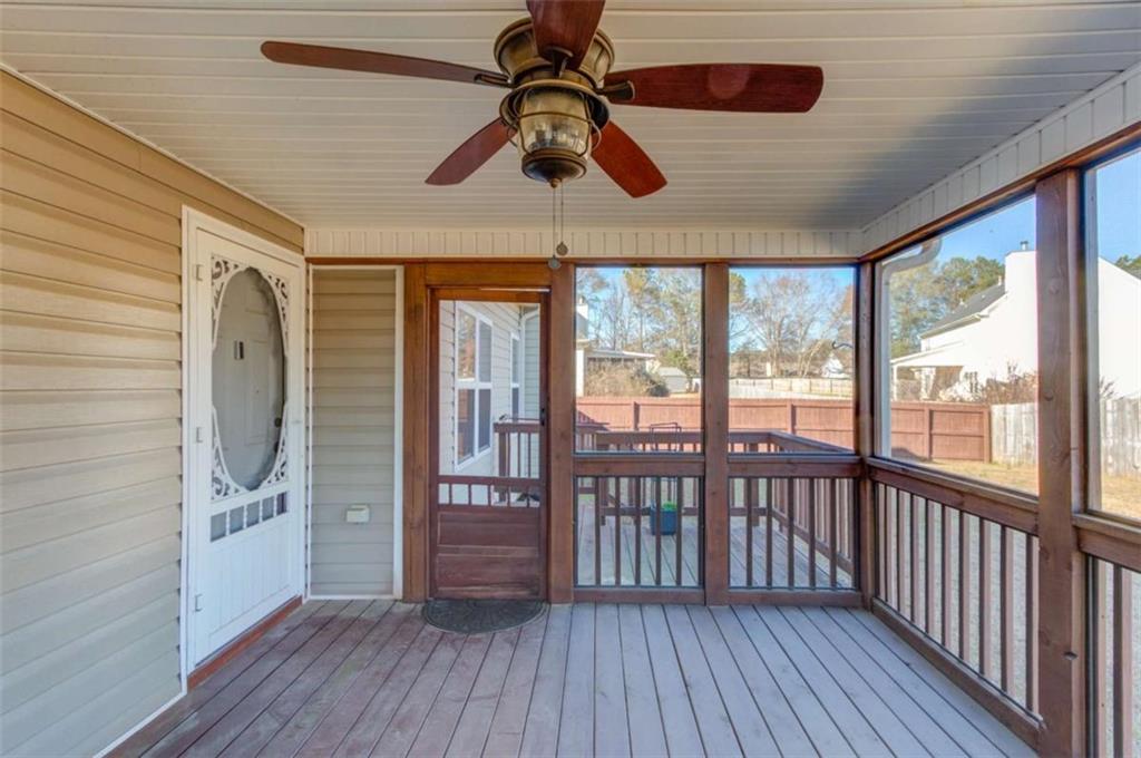 3322 Henderson View Court Southwest Loganville, GA 30052 - Photo 40 of 47 a view of a room with wooden floor fan and windows