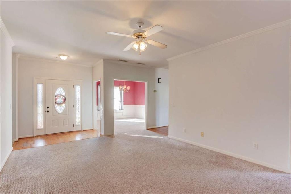 3322 Henderson View Court Southwest Loganville, GA 30052 - Photo 9 of 47 en empty room with windows and fan