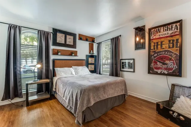 a bedroom with double bed and a window