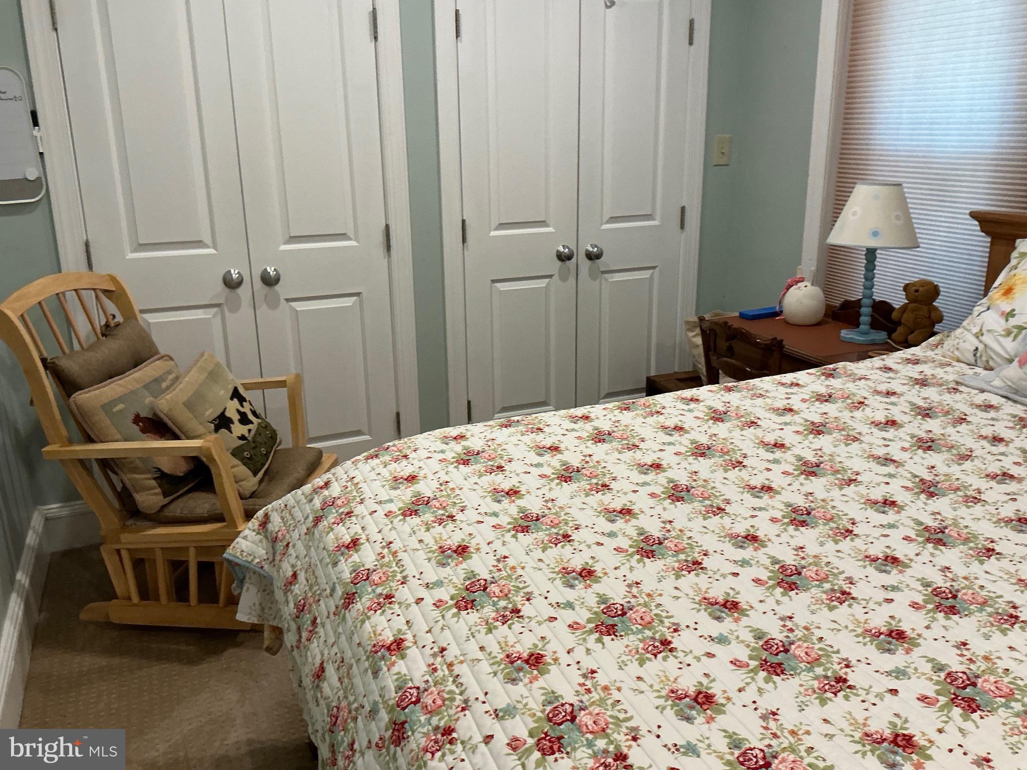29 Centre Street Haddonfield, NJ 08033 - Photo 30 of 39 a bedroom with a bed and a chair