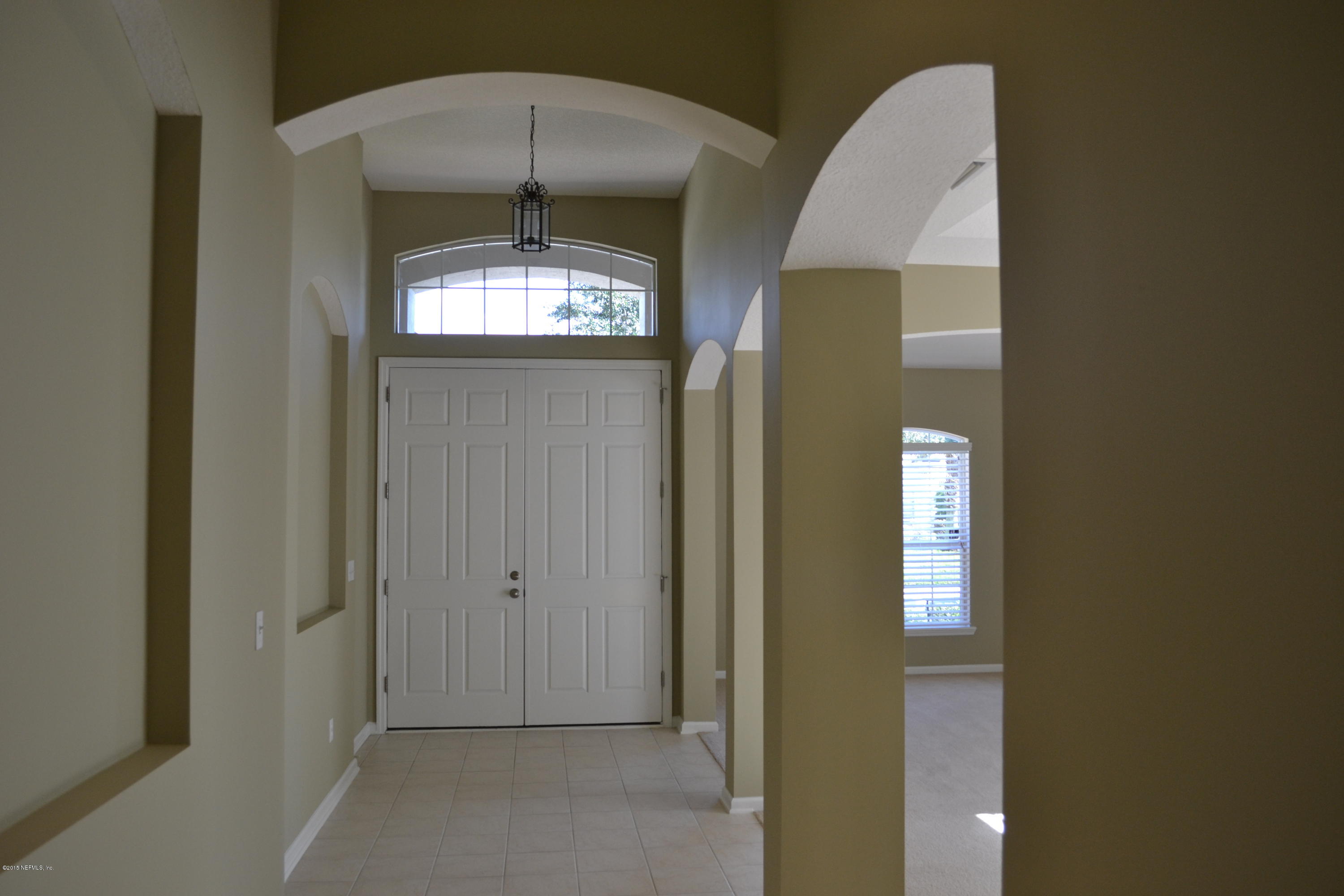 14422 Millhopper Road Jacksonville, FL 32258 - Photo 11 of 65 a view of a room that has a large window and front door