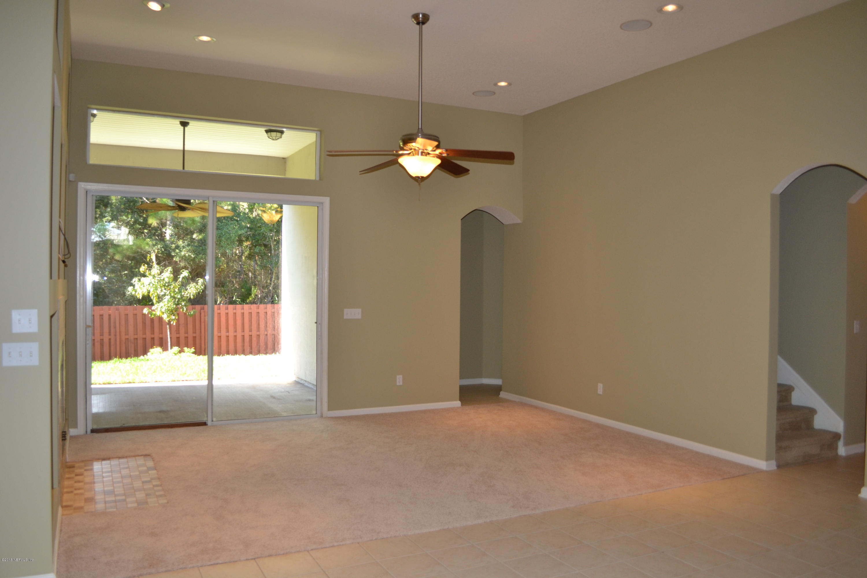 14422 Millhopper Road Jacksonville, FL 32258 - Photo 12 of 65 a view of a living room with a flat screen tv