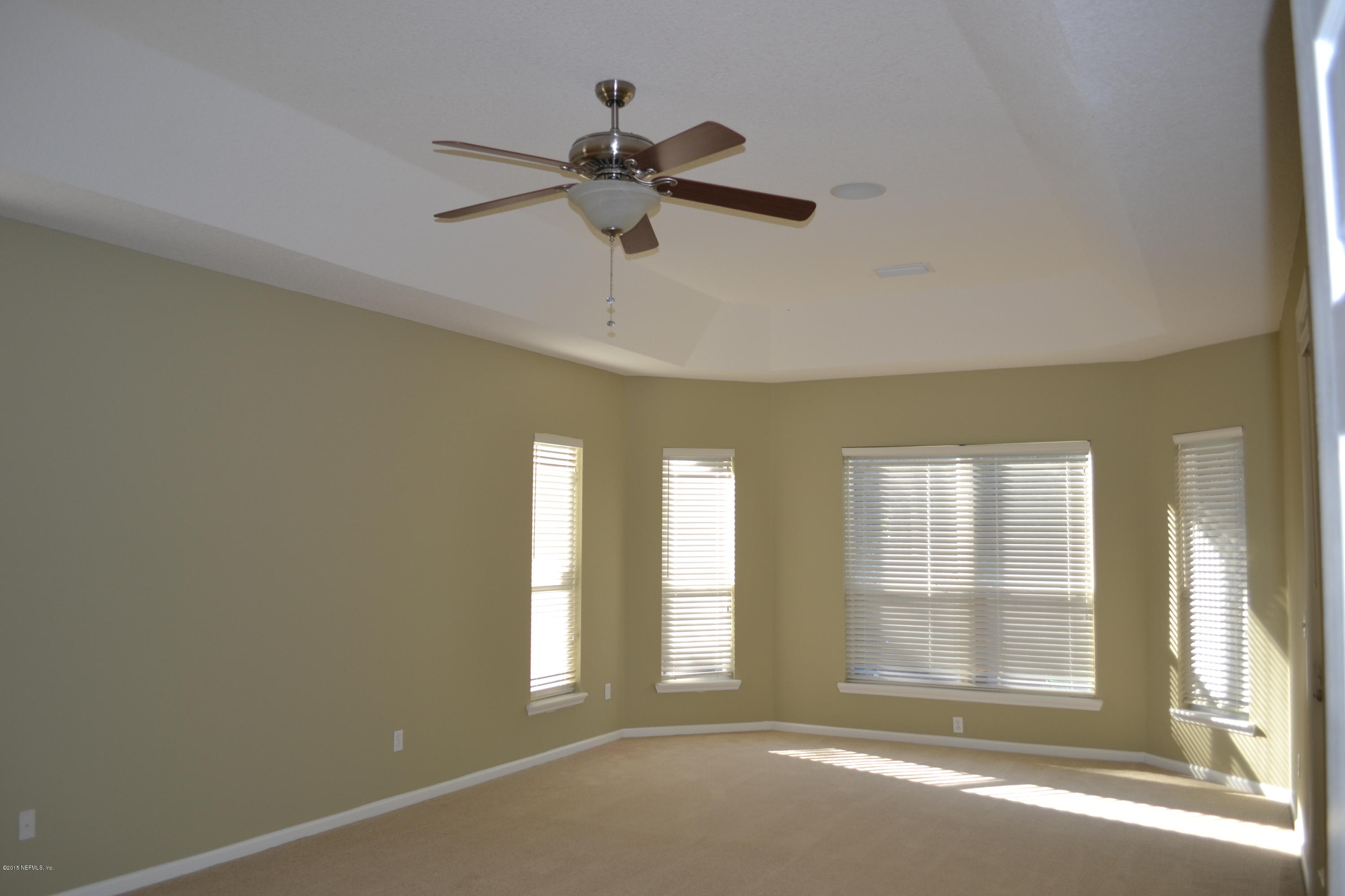 14422 Millhopper Road Jacksonville, FL 32258 - Photo 16 of 65 a view of an empty room with a window