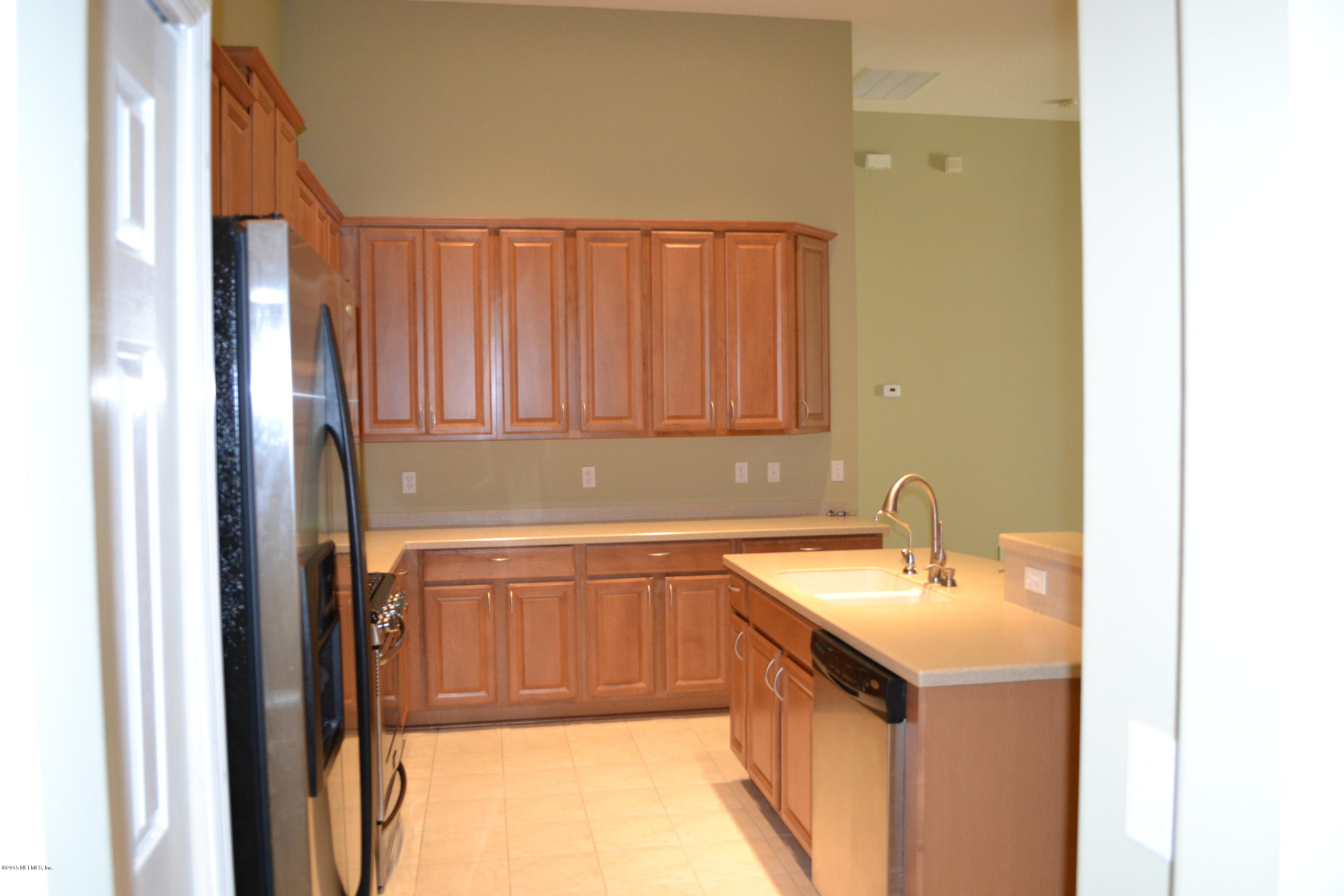 14422 Millhopper Road Jacksonville, FL 32258 - Photo 29 of 65 a bathroom with a sink and a mirror