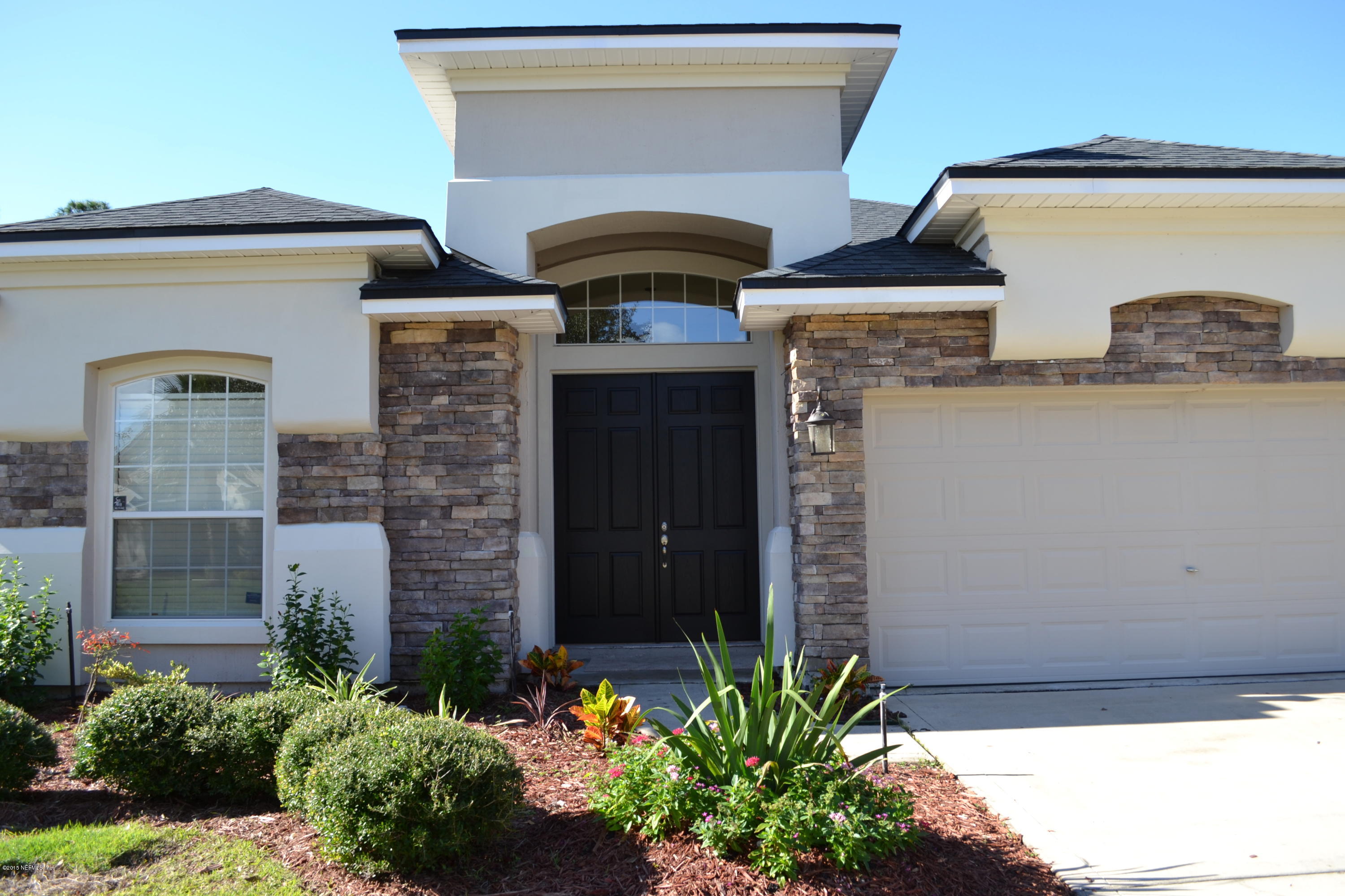 14422 Millhopper Road Jacksonville, FL 32258 - Photo 3 of 65 a front view of a house with potted plants