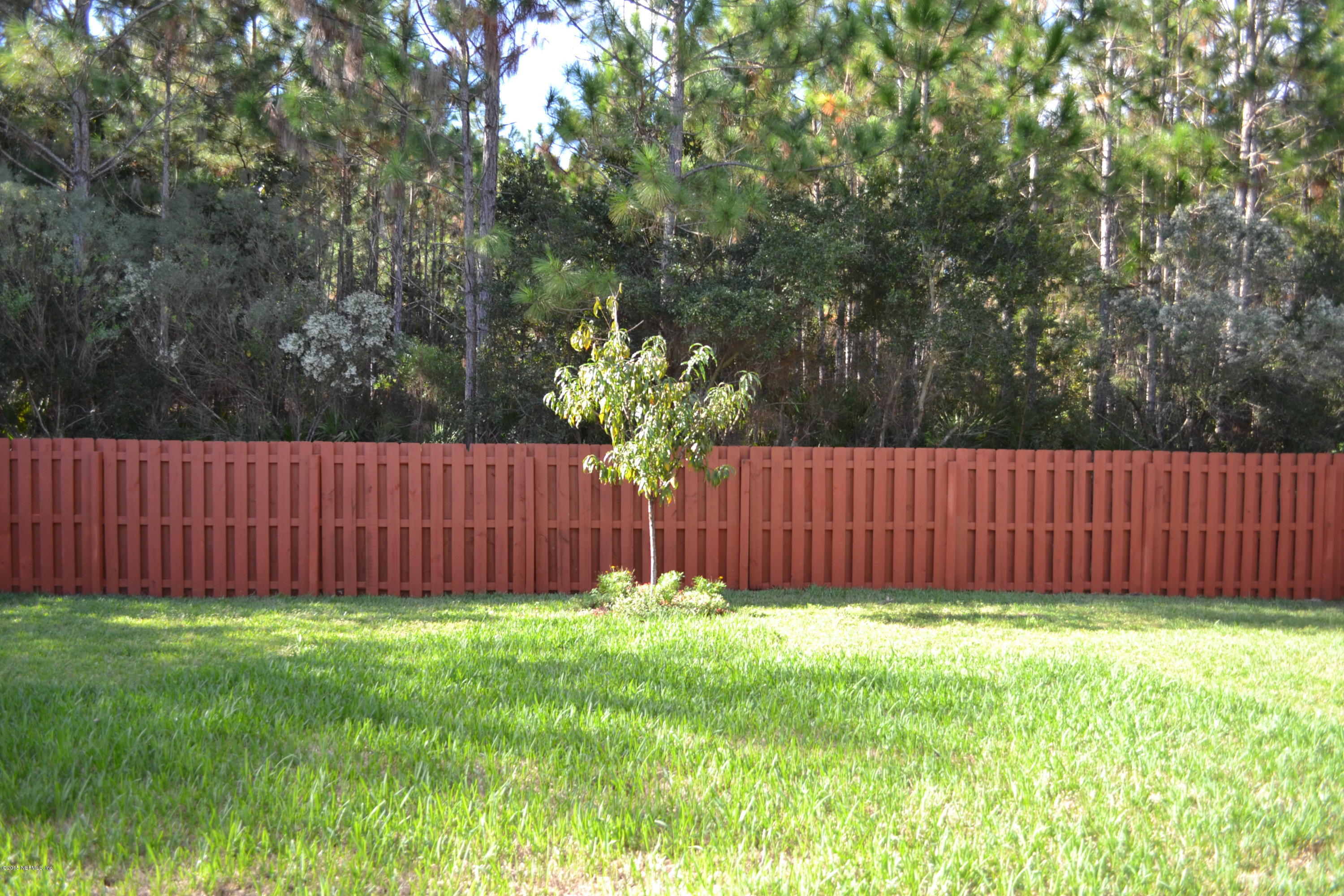 14422 Millhopper Road Jacksonville, FL 32258 - Photo 47 of 65 a view of backyard with wooden fence