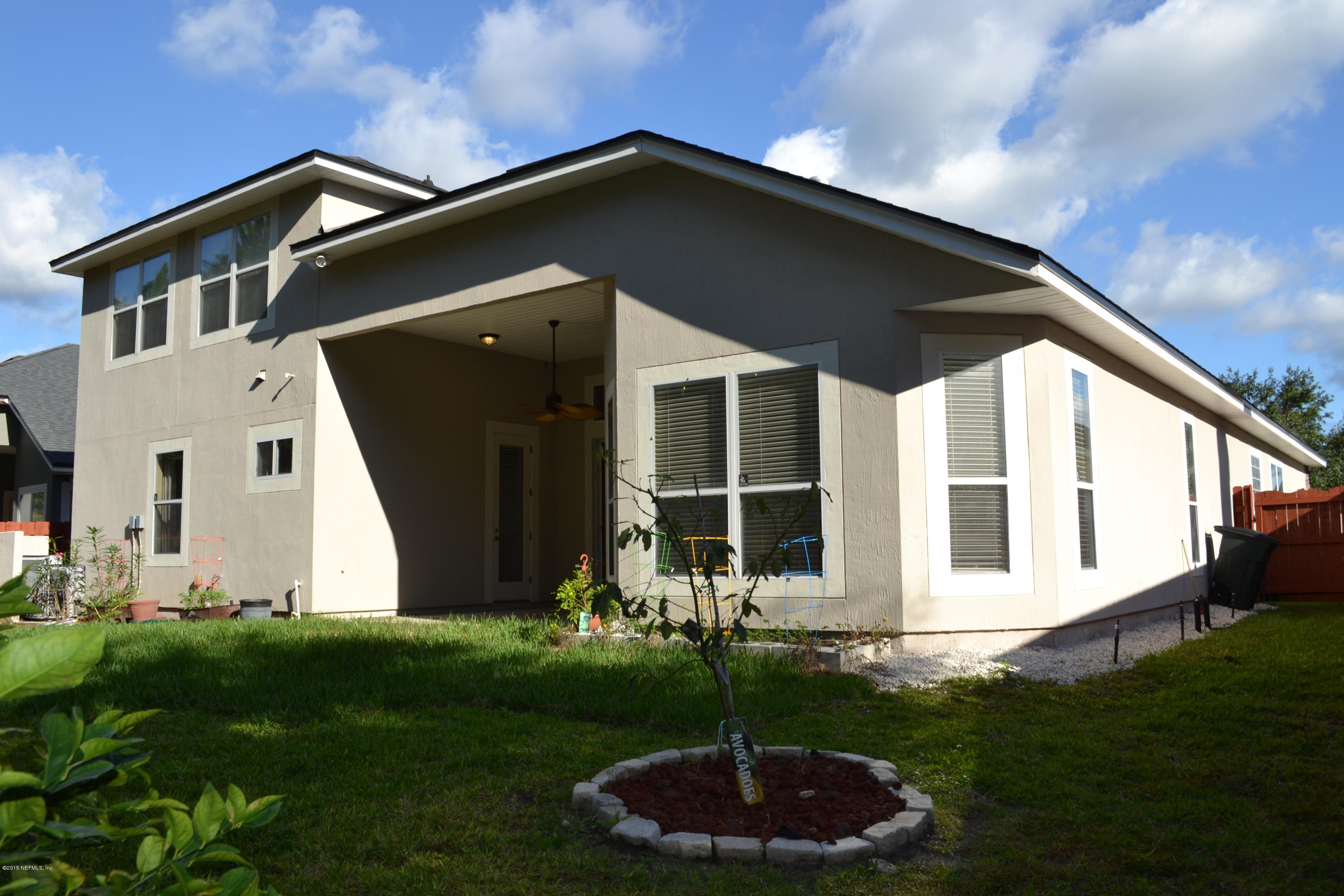 14422 Millhopper Road Jacksonville, FL 32258 - Photo 51 of 65 a front view of a house with garden