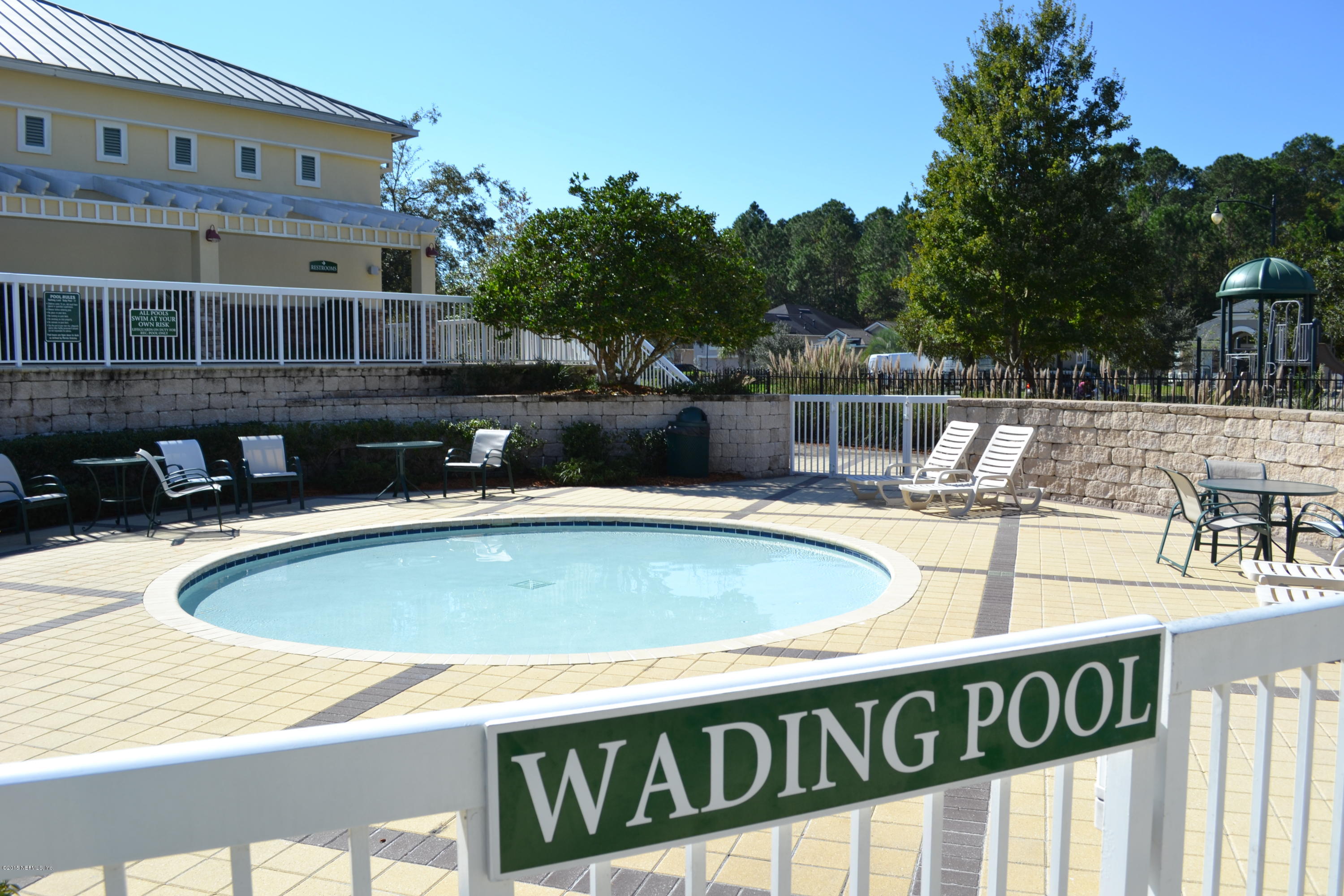 14422 Millhopper Road Jacksonville, FL 32258 - Photo 64 of 65 a view of a swimming pool with a lawn chairs