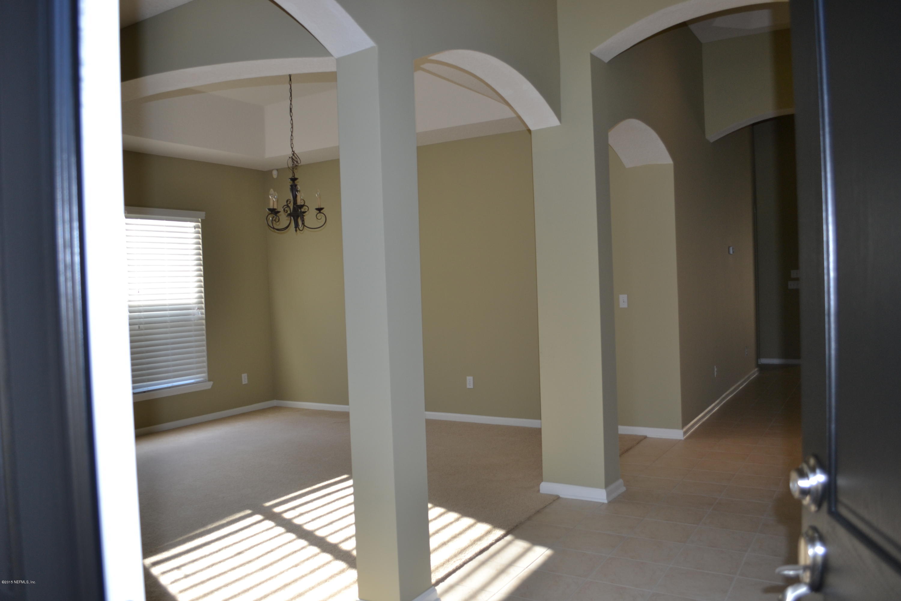 14422 Millhopper Road Jacksonville, FL 32258 - Photo 7 of 65 a view of a bathroom from a hallway