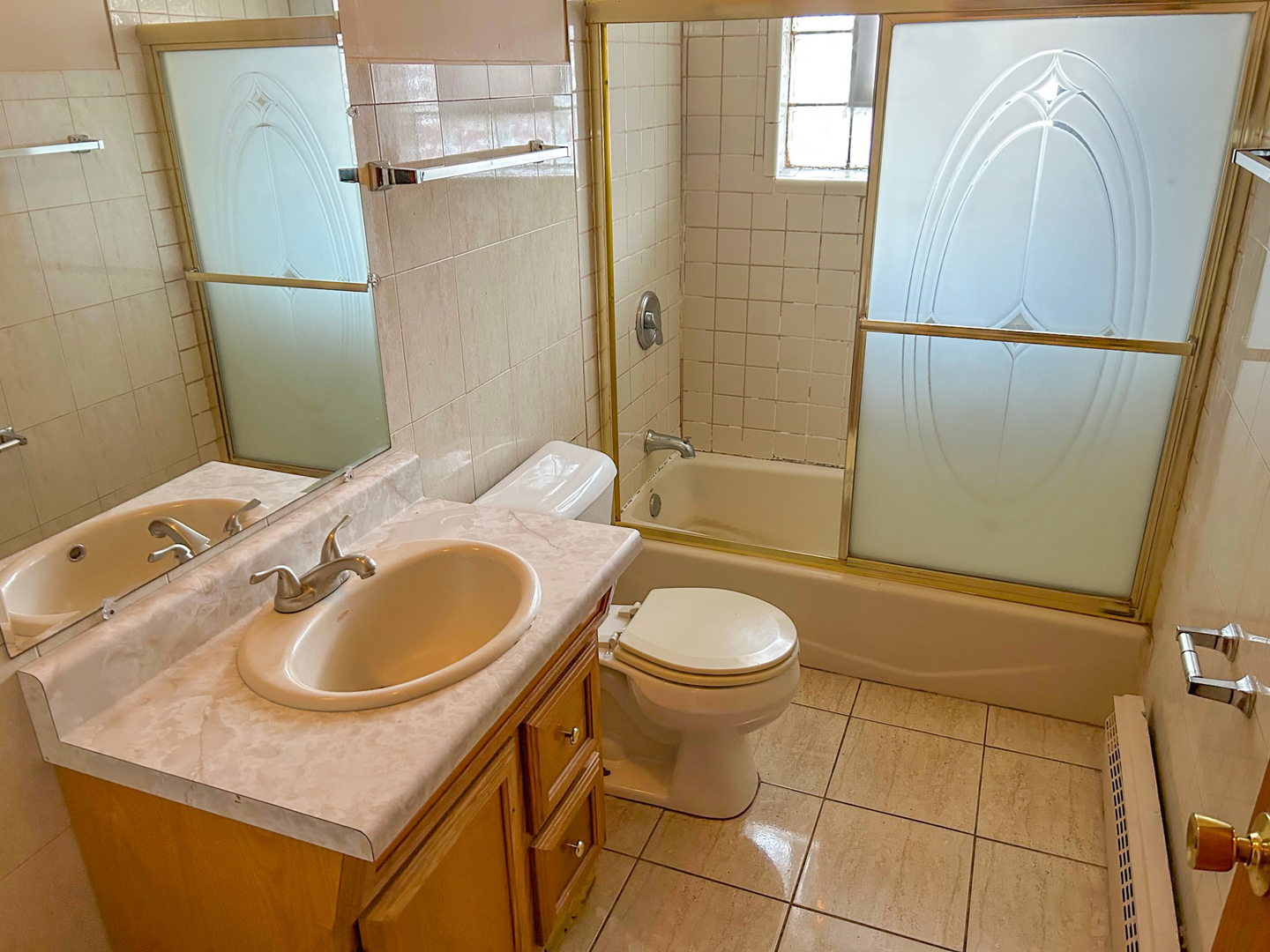 12919 South Escanaba Avenue Chicago, IL 60633 - Photo 11 of 16 a bathroom with a sink toilet and shower