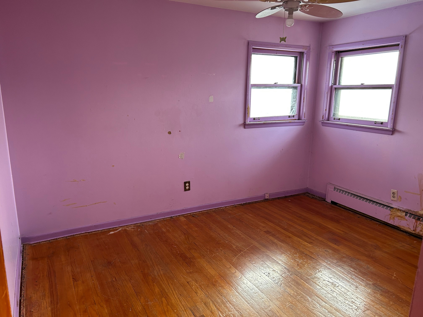 12919 South Escanaba Avenue Chicago, IL 60633 - Photo 13 of 16 a view of an empty room with wooden floor and windows