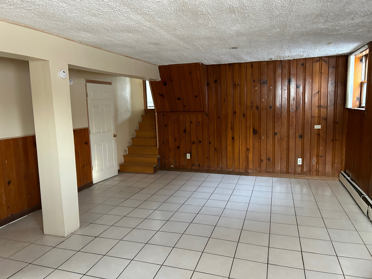 12919 South Escanaba Avenue Chicago, IL 60633 - Photo 16 of 16 an empty room with windows